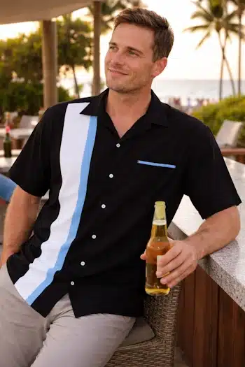Relaxing at the beach in retro style bowling shirt