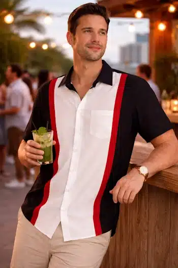 Masn in Beach bar- wearing black and white casual shirt in retro style